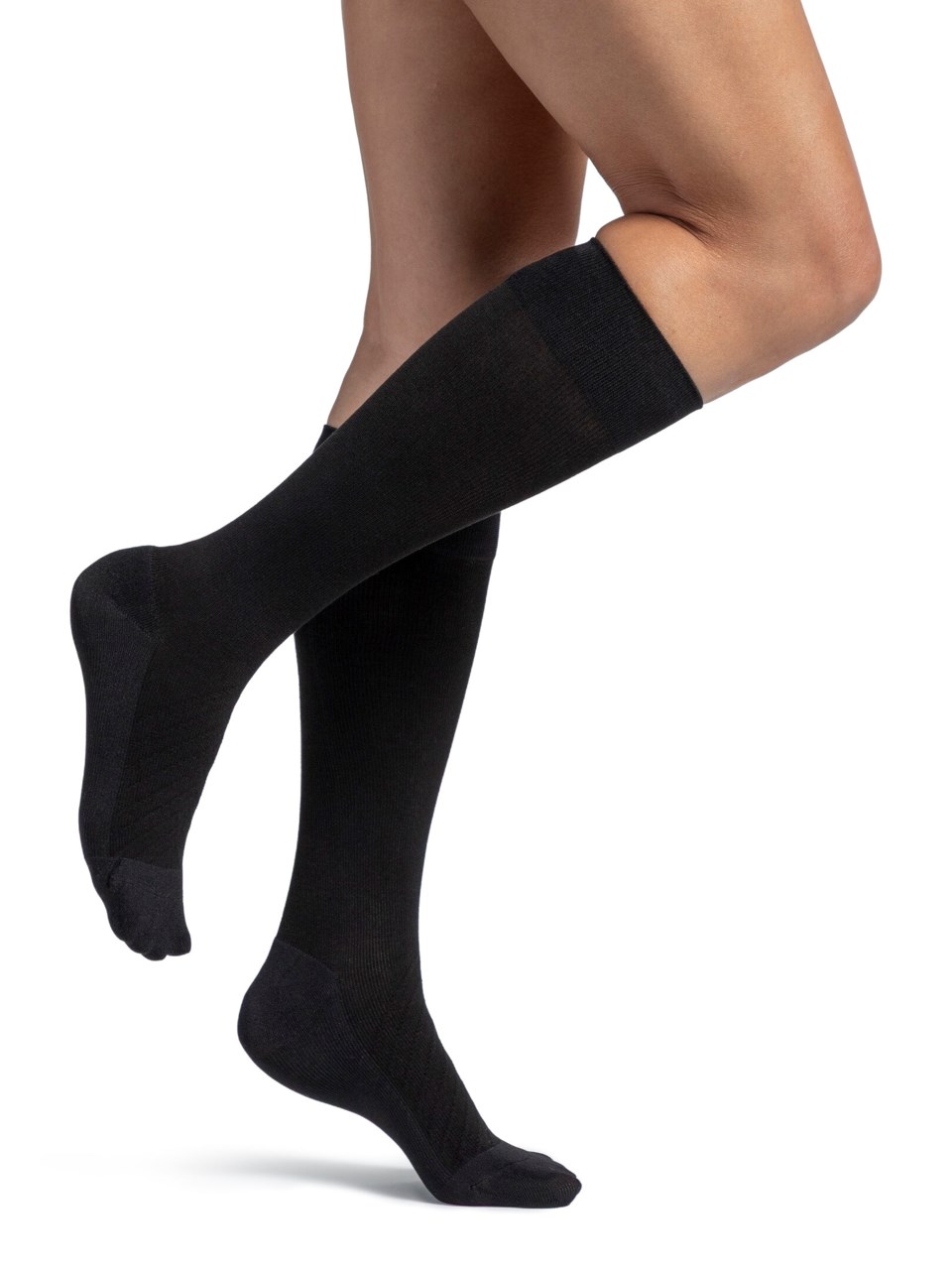 Woman wearing Sigvaris Style Bamboo compression socks in the color Black