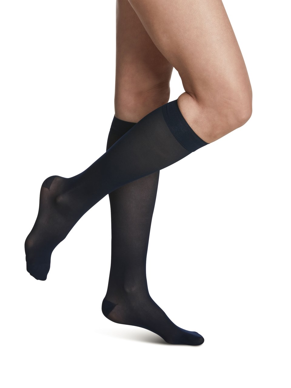 Female wearing STYLE SHEER compression calf stockings in DARK NAVY